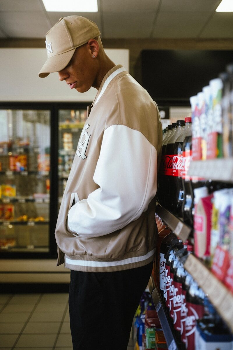 Young man in a bomber jacket at a convenience store